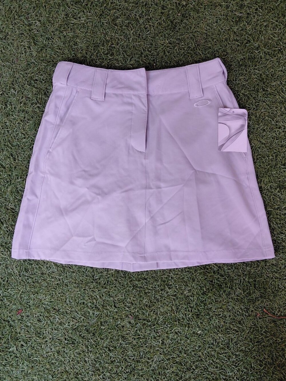 Oakley women's athletic grey skirt w/pockets. Brand new with tags - size 2